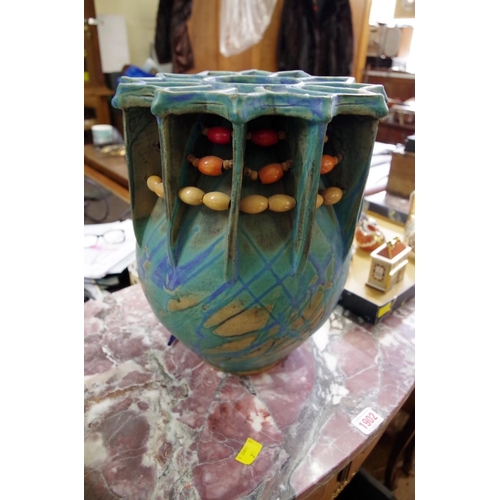 1904 - An unusual studio pottery vase, by T Blewitt, 33cm high.