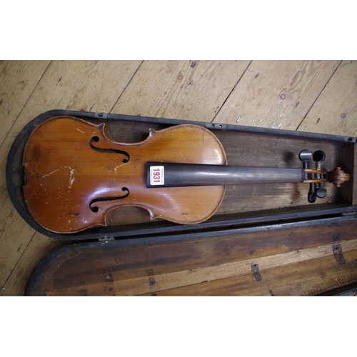 1931 - An antique Continental violin, with 14in back, in associated ebonized wood case.