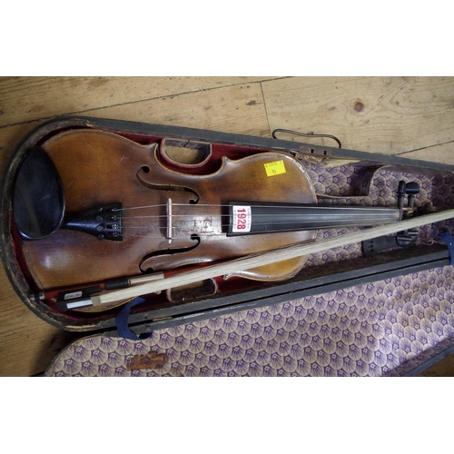 1928 - An antique Continental violin, with 14in back, with ebonized wood case and bow.