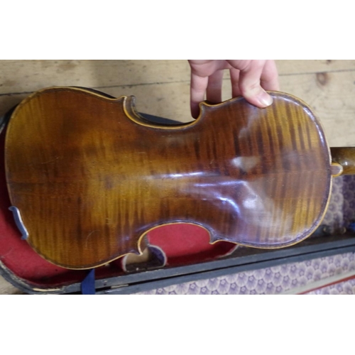 1928 - An antique Continental violin, with 14in back, with ebonized wood case and bow.