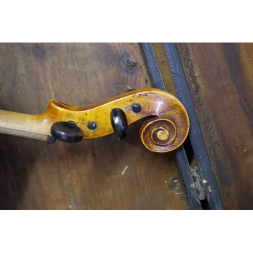 1931 - An antique Continental violin, with 14in back, in associated ebonized wood case.