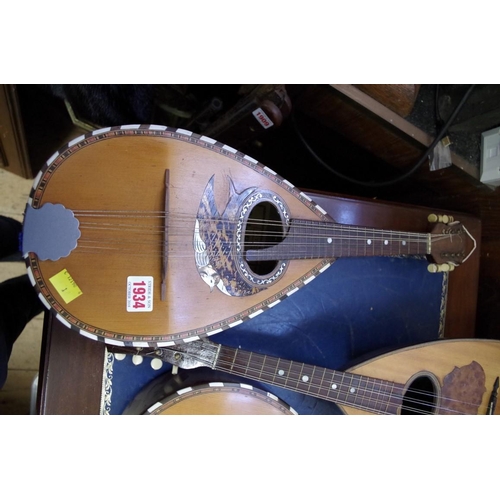 1934 - An eight string mandolin, labelled 'Carlo Ricordo'. 