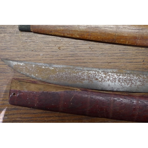 1949 - A Burmese dha and wood scabbard, with 58cm blade; together with another similar scabbard.... 