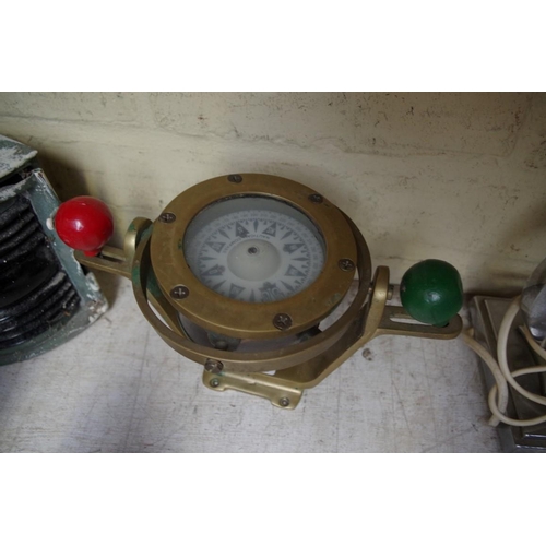 1427 - A brass cased nautical compass. 