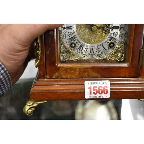 1566 - A small 18th century style walnut mantel clock, 24cm high.