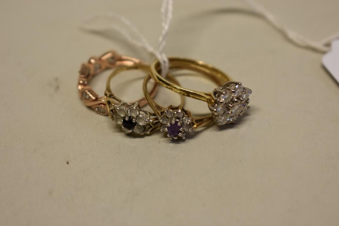 Four 9ct gold modern gem set rings.