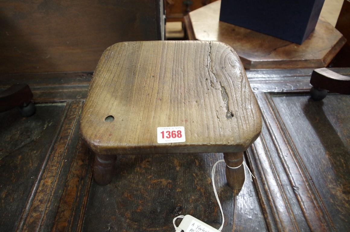 A 19th century ash milking stool,
