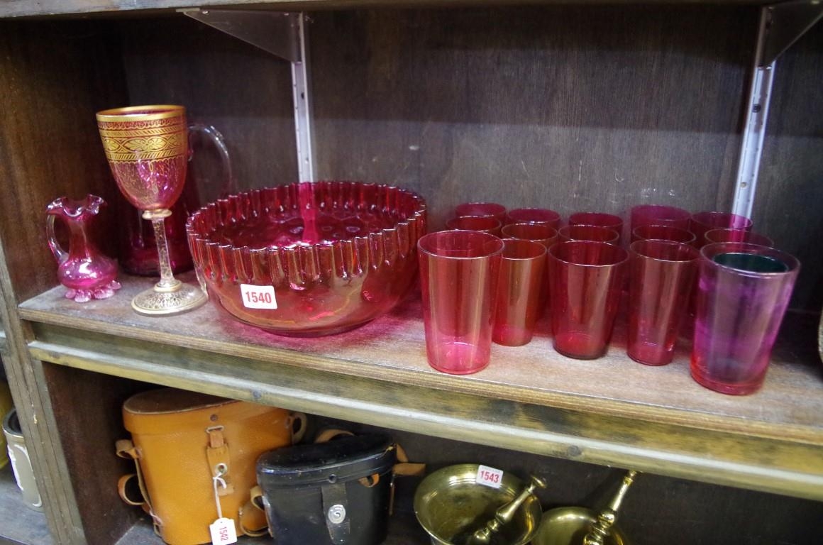A collection of cranberry glass,