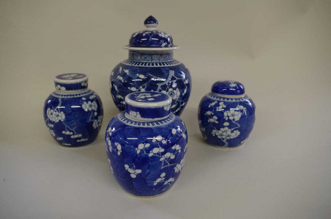 Four Chinese blue and white prunus jars and covers,