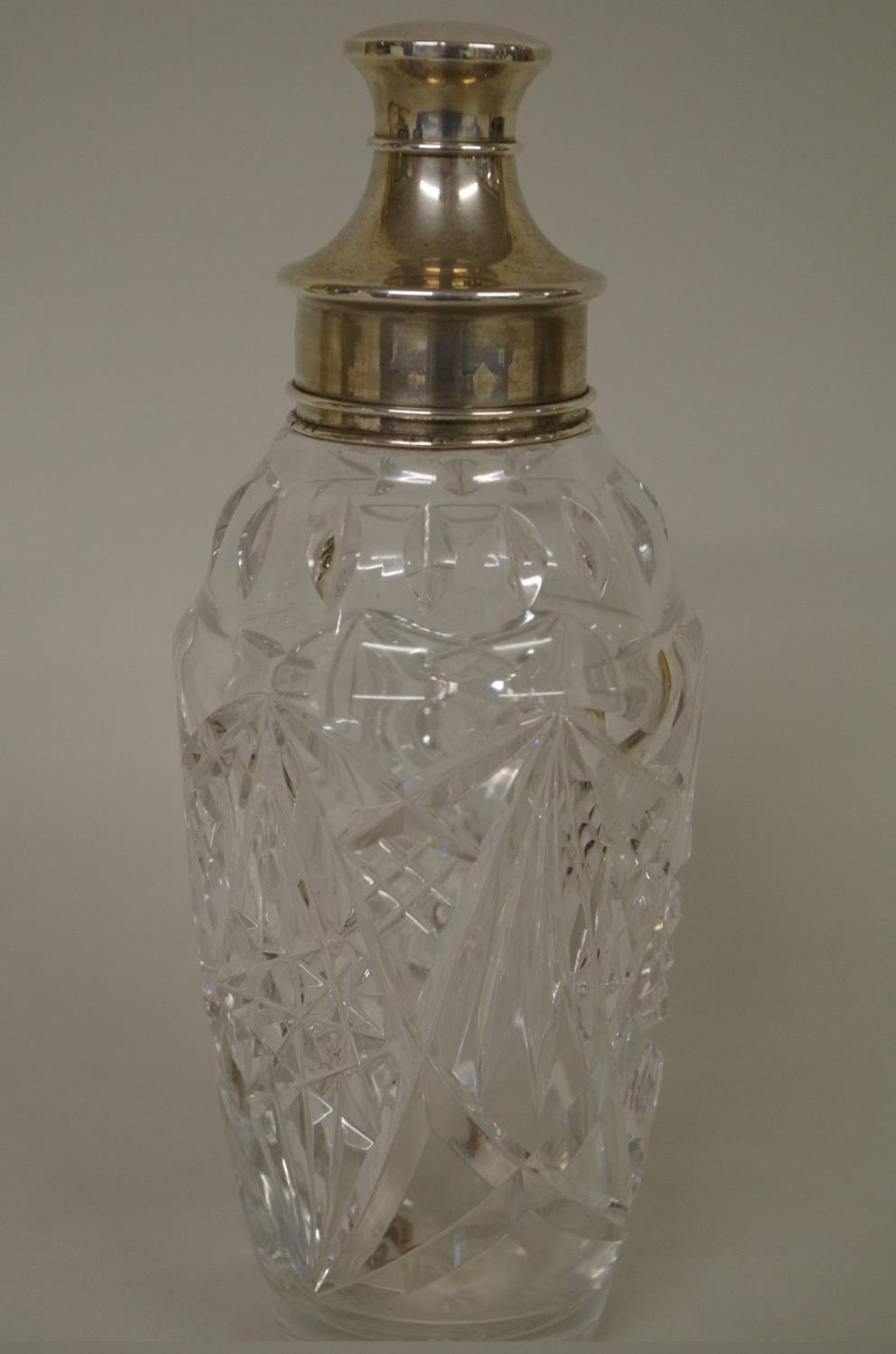 A cut glass and silver mounted cocktail shaker,