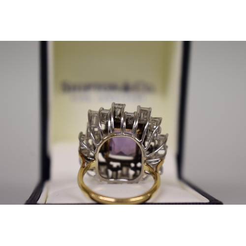 295 - A large amethyst and baguette diamond cocktail ring, stamped 18ct.