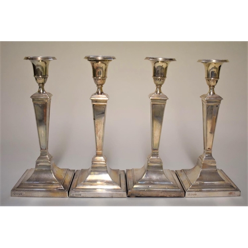 15 - A set of four Edwardian silver candlesticks, by Hawsworth, Eyre & Co Ltd, Sheffield 1910/11, 25.... 