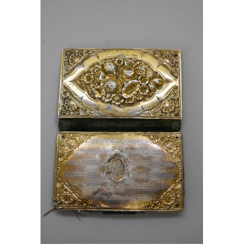 44 - A Victorian gilt metal silk lined aide memoir and card case, 9cm.