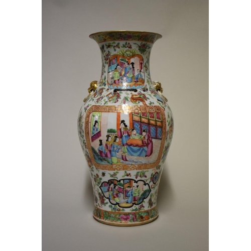 501 - A Chinese Canton famille rose twin handled vase, 19th century, 38cm high, (restoration to rim).... 