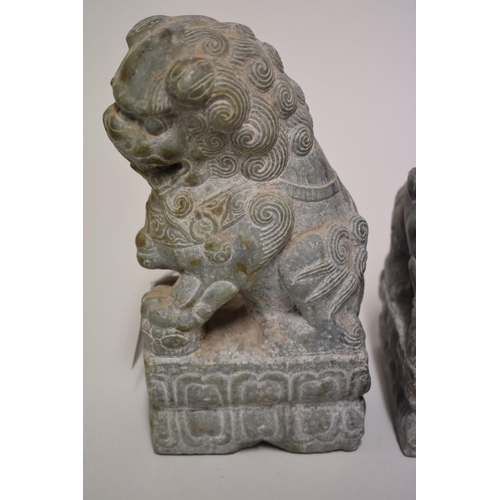 530 - A pair of Chinese green jade or soapstone lion dogs, 21.5cm high. (2)