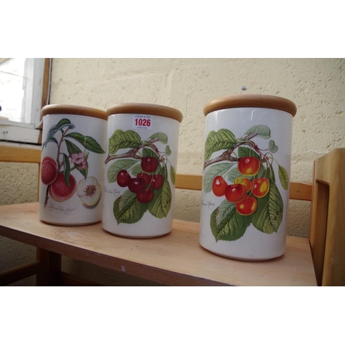 1026 - Three Portmeirion 'Pomona' storage jars and wooden covers, 21.5cm high.