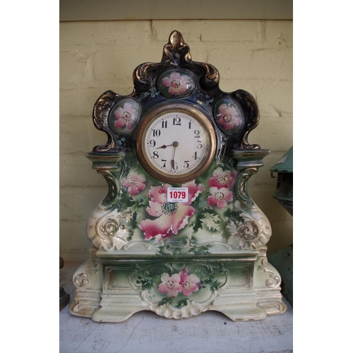 1079 - An old pottery mantel timepiece, 42cm high.
