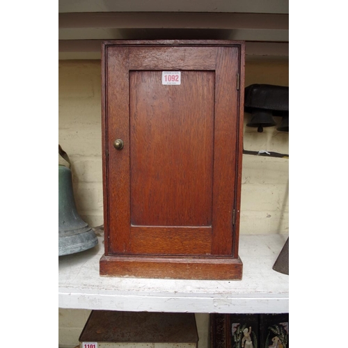 1092 - A small antique oak cabinet, 41.5cm high.