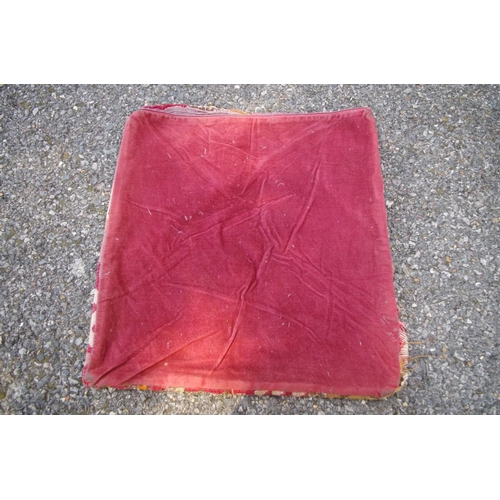 1100 - A kilim cushion, 40 x 39cm, (a.f.); together with a silk tassel tie back.