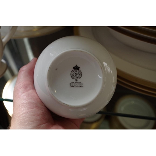 1130 - A Royal Worcester 'Davenham Gold' pattern porcelain service, comprising: three oval serving plates, ... 