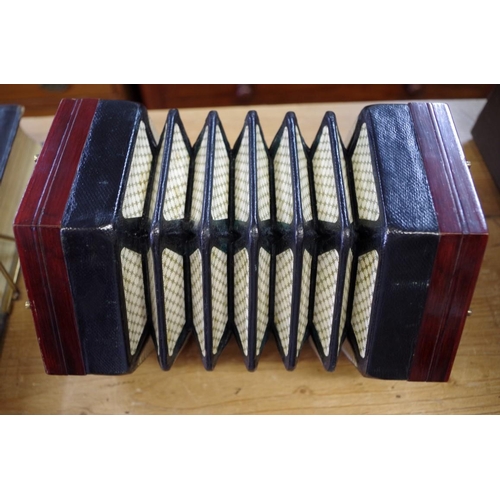 1210 - A good 19th century rosewood concertina, labelled 'Lachenal & Co', and numbered 41469, in mahoga... 