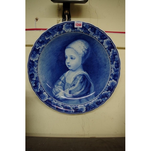 1244 - A Dutch Delft blue and white charger, painted with James II as a child, after Anthony Van Dyck, 41.5... 