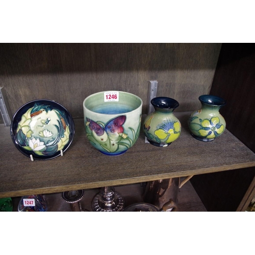 1246 - Four Moorcroft items, comprising: an 'Arum Lily' pattern vase, 10.5cm high; a 'Lamia' pattern dish, ... 