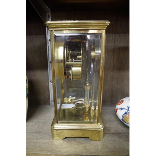 1263 - An Ansonia brass four glass mantel clock, with exposed escapement and mercury pendulum, 27.5cm high,... 