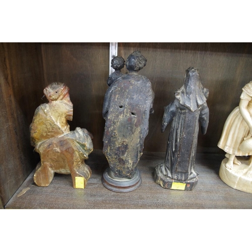 1284 - An interesting group of three carved wood figures, probably 18th century or earlier, largest 26... 