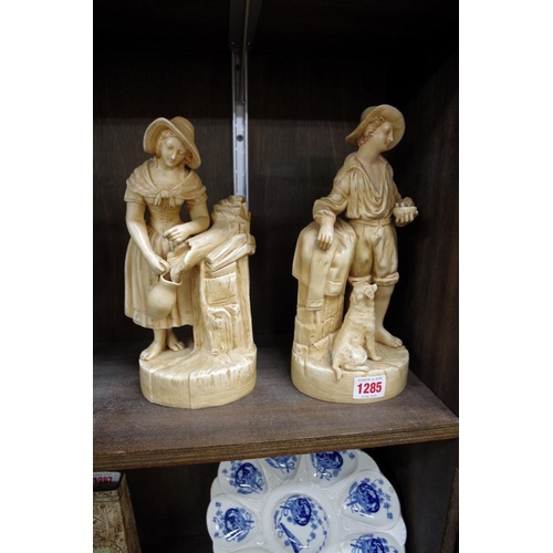 1285 - A pair of Robinson and Leadbeater vellum ware figures, 27cm high.