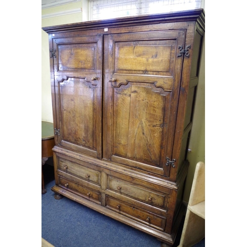 1376 - An oak press cupboard, comprising 18th century elements, enclosing hanging space, 148.5cm wide.   ... 