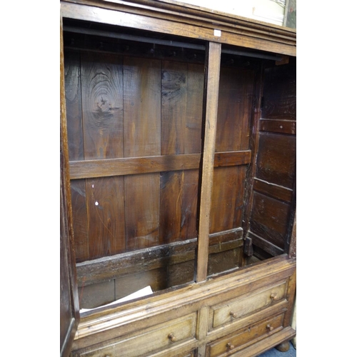 1376 - An oak press cupboard, comprising 18th century elements, enclosing hanging space, 148.5cm wide.   ... 