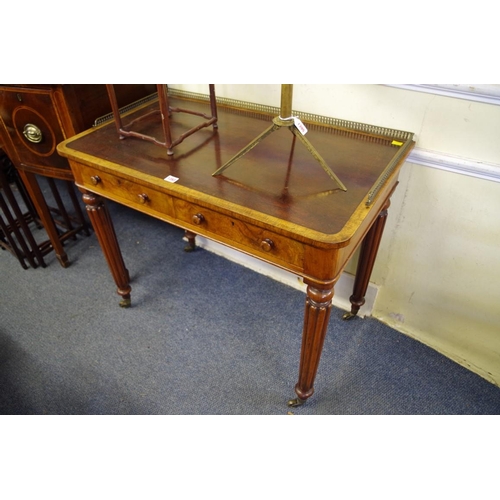 1393 - A good 19th century figured walnut writing table, in the manner of Gillows, with brass three quarter... 