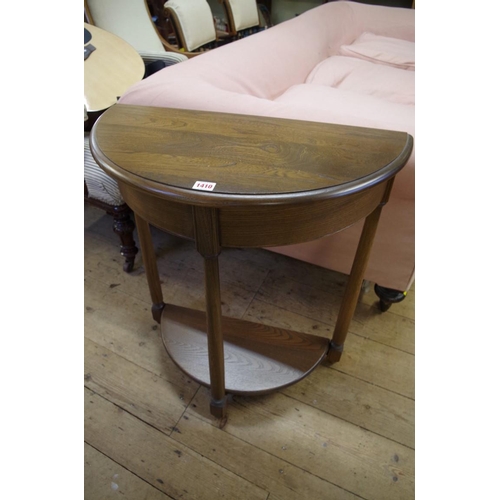 1410 - A nest of three Ercol 'Golden Dawn' tables, largest 61cm wide; together with a matching demi-lune si... 