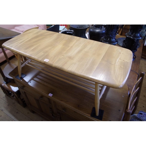 1412 - A vintage Ercol 'Blonde' Elm coffee table, 105cm wide.