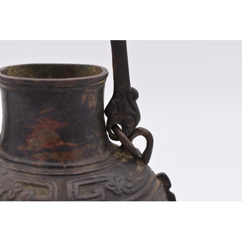 608 - WITHDRAWN FROM SALE: A Chinese Archaistic bronze swing handled wine vessel and cover Hu, mark to bas... 