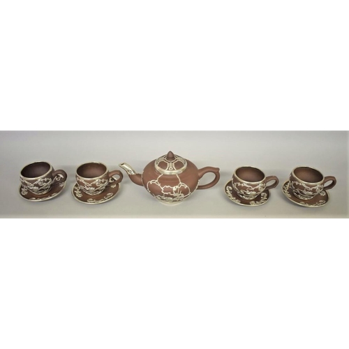 627 - A Chinese yixing and white metal mounted part tea service, seal mark to base, decorated wi... 