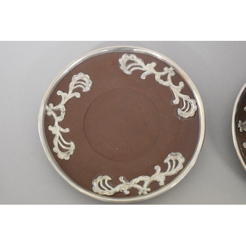 627 - A Chinese yixing and white metal mounted part tea service, seal mark to base, decorated wi... 