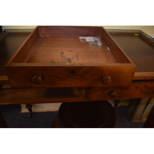 1393 - A good 19th century figured walnut writing table, in the manner of Gillows, with brass three quarter... 