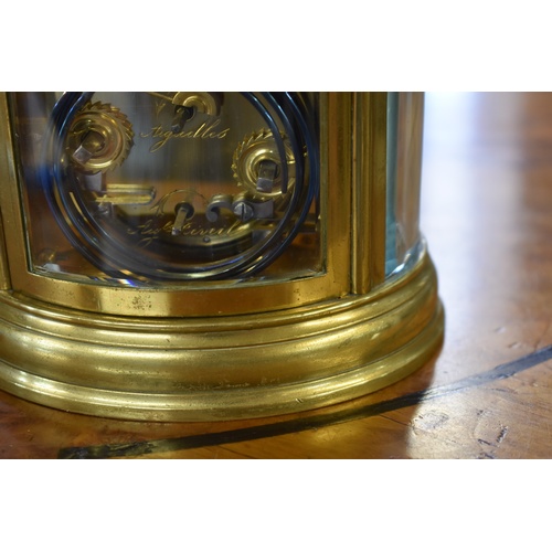 1324 - A good antique brass oval grande and petite sonnerie carriage clock, with alarm and push button repe... 