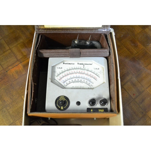 1384 - A Protimeter 'Timbermaster' moisture meter, in case; together with two leather cased tape measures.... 