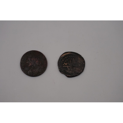 308 - Coins: a Scottish Charles II copper bawbee or sixpence; together with an Islamic hammered copper coi... 