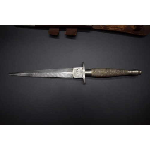 1671 - A rare Fairbairn Sykes 1st pattern fighting knife, by Wilkinson Sword, with 17cm blade, the handle n... 