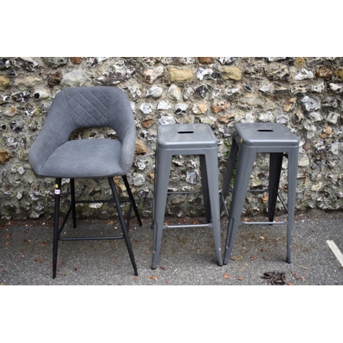 1009 - A grey upholstered bar stool; together with two other metal bar stools. 