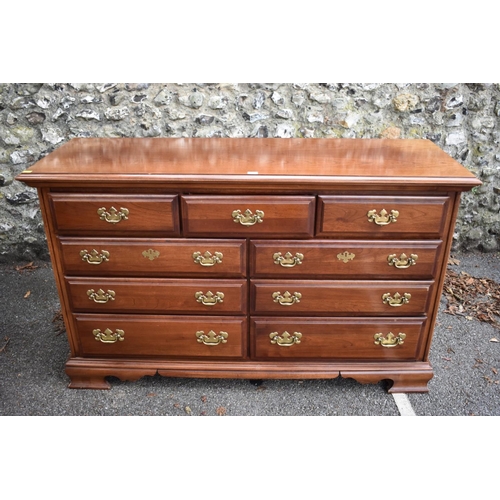1010a - A large reproduction mahogany chest of drawers, by Dixie.