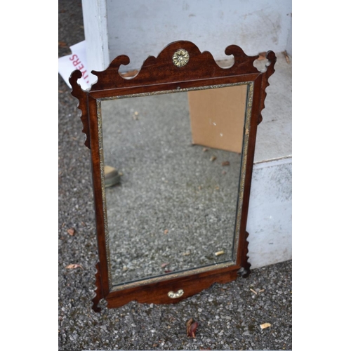 1016 - Two gilt wall mirrors; together with a fretwork mirror and one other.