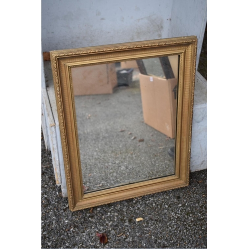 1016 - Two gilt wall mirrors; together with a fretwork mirror and one other.