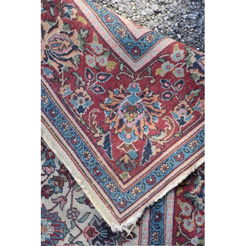 1080 - A Persian rug, having floral medallions with allover floral central field, 176 x 125cm. ... 