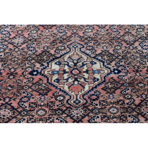 1104 - A Persian rug, having central medallion, with geometric borders, 200 x 158cm. ... 