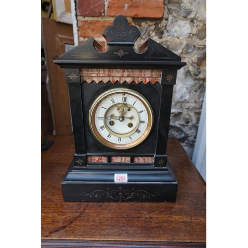 1291 - A late 19th century slate and marble mantel clock, with pendulum. 